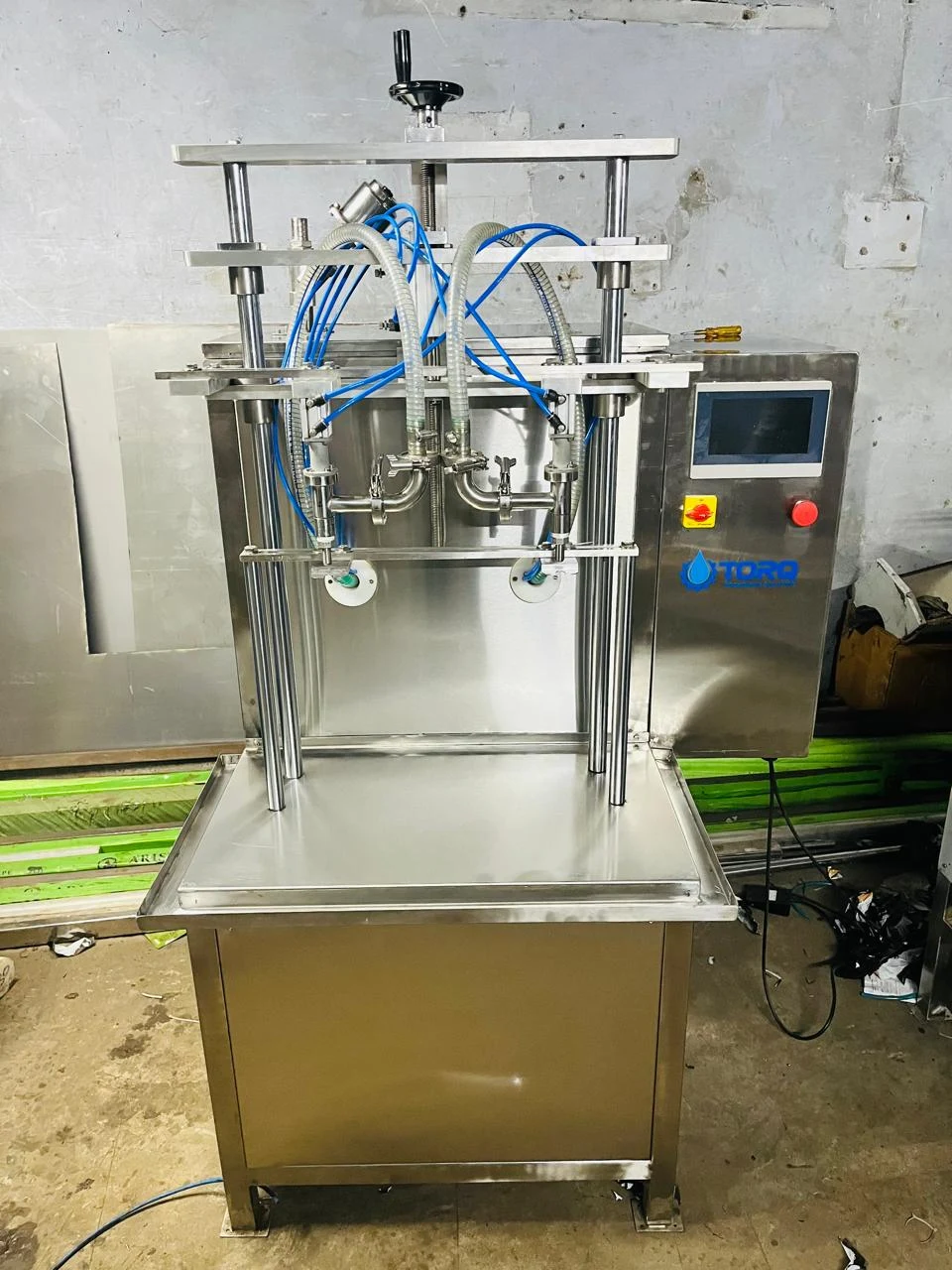 Two-head pouch and bottle filling machine