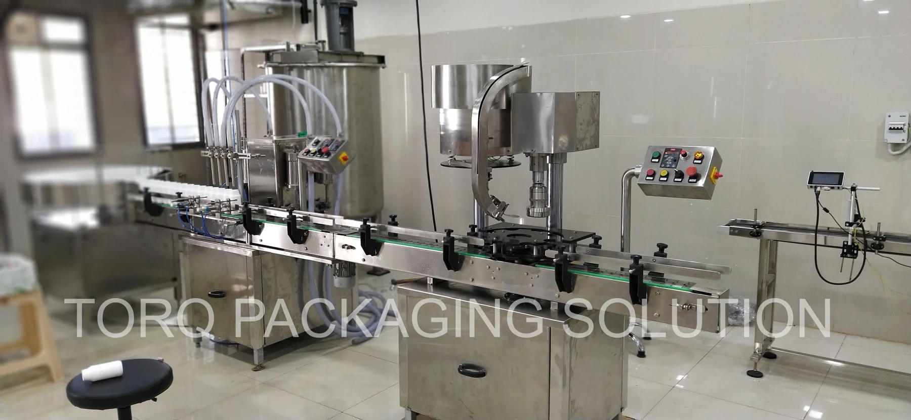 Four-head filling and capping line
