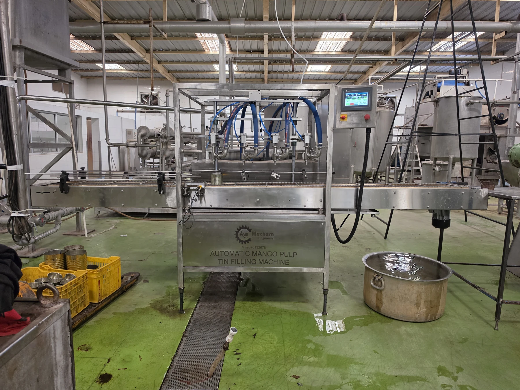 Multi-nozzle conveyor filling machine, view 2