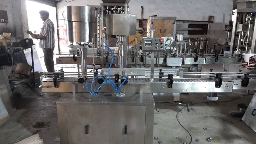 Linear capping machine